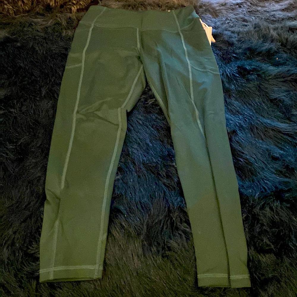 Victoria’s Secret pink high rise leggings in dark green color